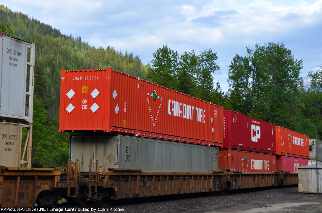 W/B unit stack train through the Taft Road crossing with DTTX 88914 carrying a 53' and 60' containers